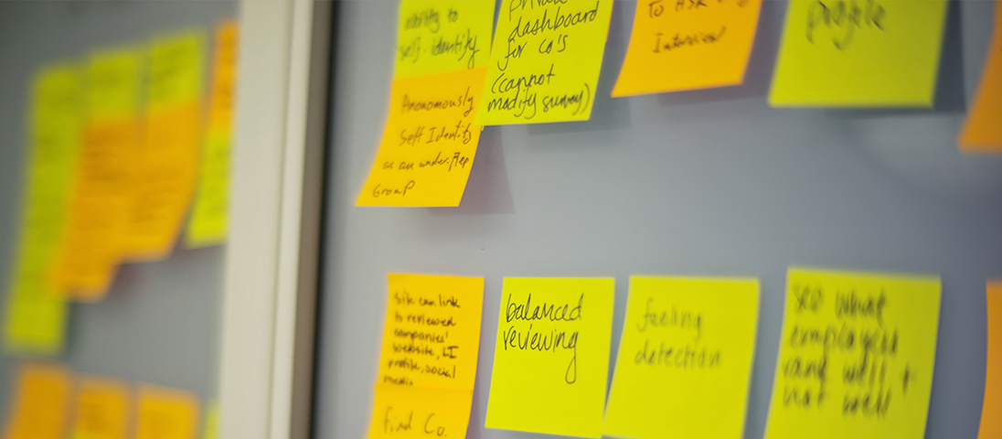 Post its on a window with writing